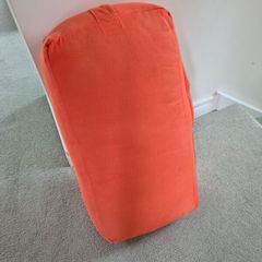 Orange yoga bolster