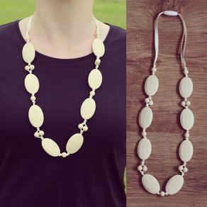 Navajo white teething necklace for babies and parents.