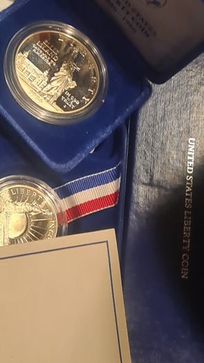 American 1986s silver dollar. Ellis Island
