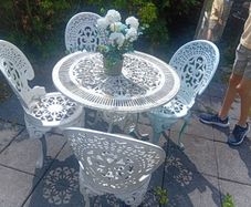cast iron table and chairs