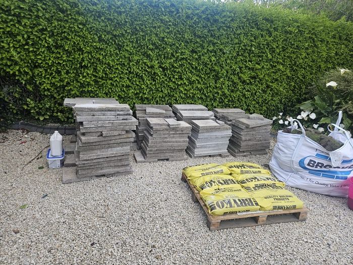 30sq m used 300mm x 600mm paving slabs & paving sand