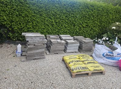 30sq m used 300mm x 600mm paving slabs & paving sand