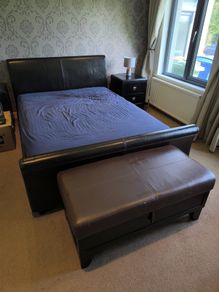 King size bed and leather headboard