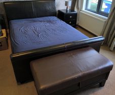 King size bed and leather headboard