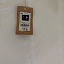 Size 12, white jeans, ankle length. Image 2