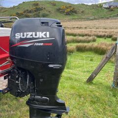 Suzuki 90 HP 4 stroke long shaft.