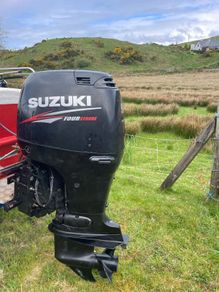 Suzuki 90 HP 4 stroke long shaft.