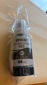 Genuine Epson 102 EcoTank black ink bottle.