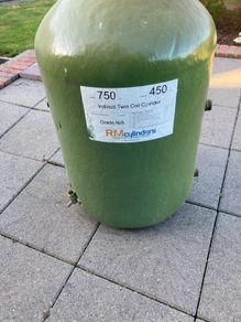 Hot water cylinder with immersion