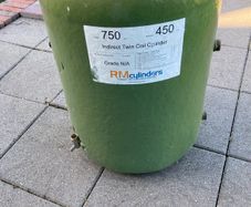 Hot water cylinder with immersion