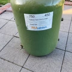 Hot water cylinder with immersion