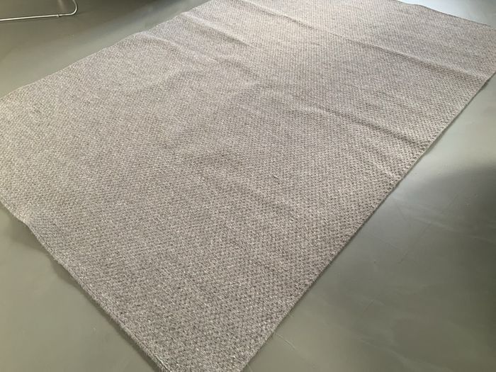 Woollen dark beige rug