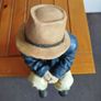 Resin sculpture of a seated boy Image 5