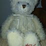 White hamleys teddy bear baby gift.  Soft white teddy with white bow. Image 3