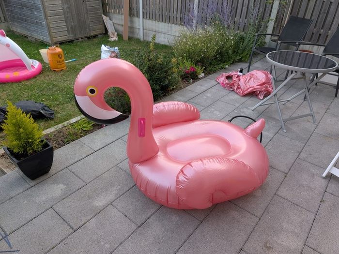 TWO inflatable flamingos