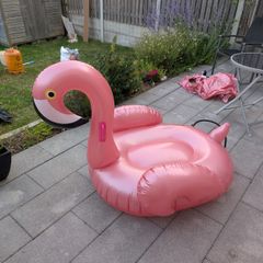 TWO inflatable flamingos