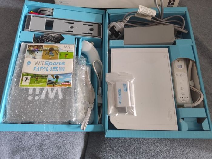 Wii with box, two controllers, sports and HDMI adapter