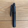 black extendable selfie stick and mini-tripod featuring a detachable wireless Bluetooth remote. Image 4