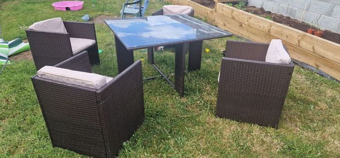 Rattan glass top table and 4 chairs