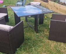 Rattan glass top table and 4 chairs