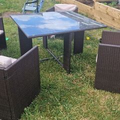 Rattan glass top table and 4 chairs