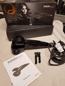 BaByliss PRO Perfect Curl styling tool, highlighting its "Auto Curl technology for creating effortless curls.