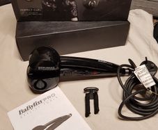 BaByliss PRO Perfect Curl styling tool, highlighting its "Auto Curl technology for creating effortless curls.