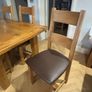 Extendable Solid Oak Dining Table & 6 leather dining chairs Image 2