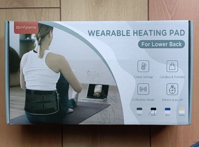 Heating and vibration pad for lower back