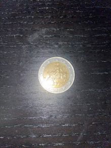 Greek man riding a bull 2 euro coin with S marking in the bottom star 2002