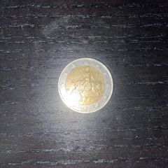 Greek man riding a bull 2 euro coin with S marking in the bottom star 2002