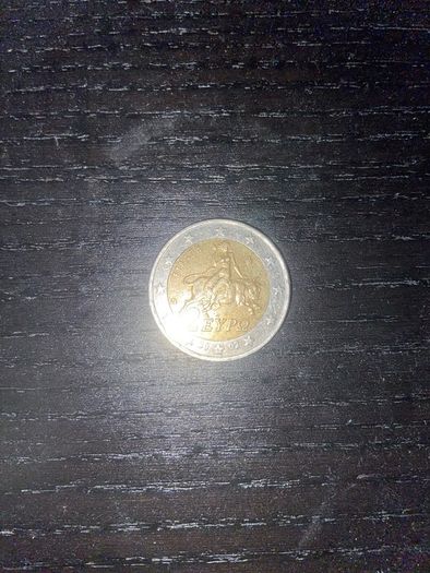 Greek man riding a bull 2 euro coin with S marking in the bottom star 2002