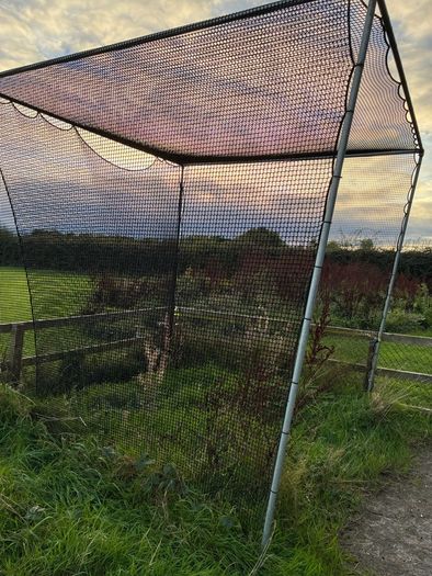 Golf hitting net with metal surround