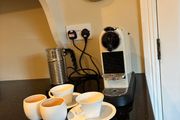 Nespresso espresso machine, milk frother and cups