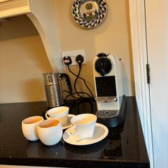Nespresso espresso machine, milk frother and cups