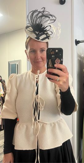 cream jacket and black skirt