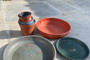Selection of small plant pots and large plant saucers