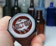 83 - Two Vintage Milton Brown Glass Bottles Bottom Embossed Letters