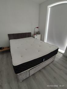 Bed King Size with memory foam mattress included in very good condition!
