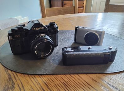 canon A-1 with 50mm lens & winder, also canon power shot A3000 both for spairs/ repair