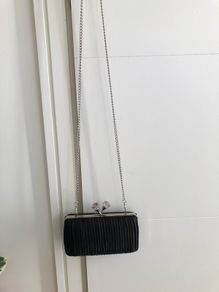 Black pleated bag with diamante clasp