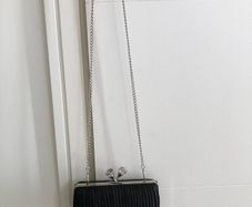 Black pleated bag with diamante clasp