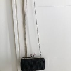 Black pleated bag with diamante clasp