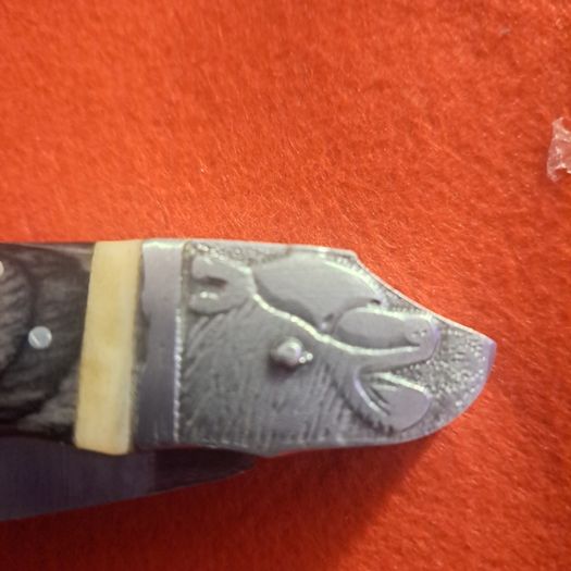 Lock knife with bear head bone handle
