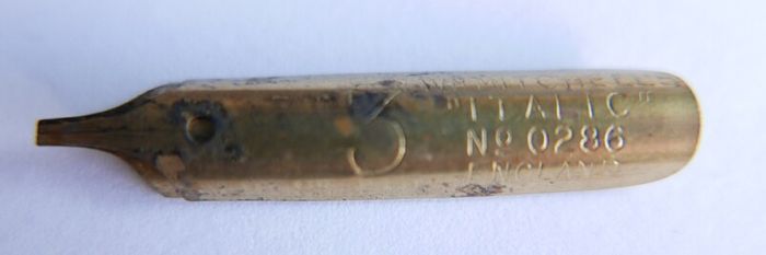 Vintage dip pen with collection of assorted nibs