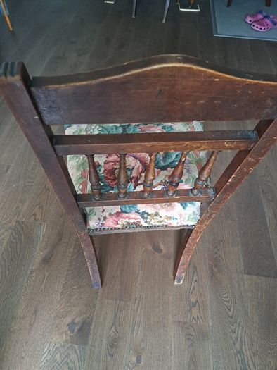 Vintage wooden chair with floral upholstery