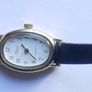 Vintage Timex womens quartz watch - gold tone oval case, white dial and black strap Image 5