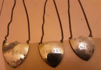 three decanter labels