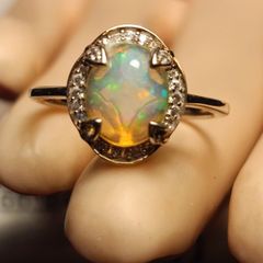 Ethiopian Welo Opal and Lab Grown Diamond Oval Cluster Ring.