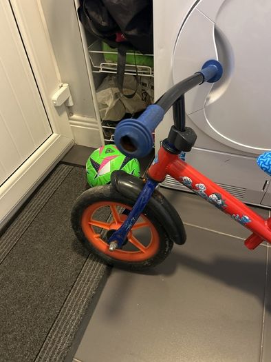 Two toddler bikes and a balance bike